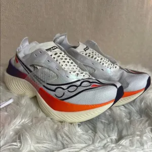 Saucony White and Orange Athletic Shoes with PWRRUN Cushioning