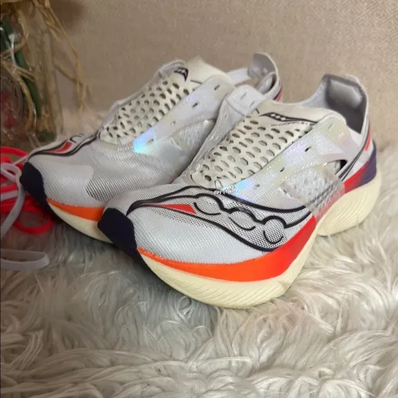 Saucony White and Orange Athletic Shoes with PWRRUN Cushioning